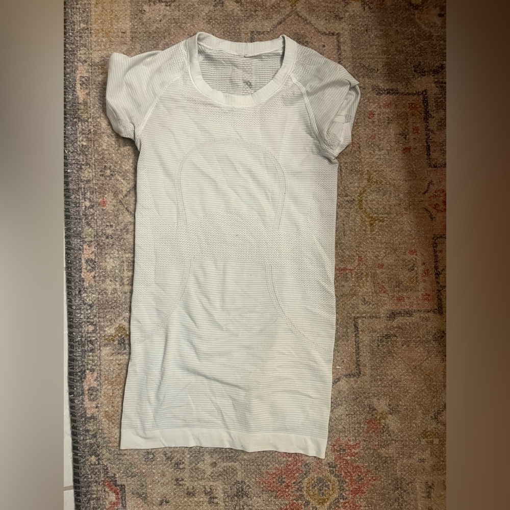 White lululemon swiftly tech short sleeve shirt, size 2. Like new.